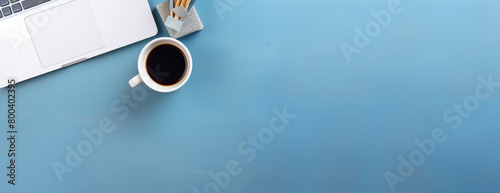 Morning cup of coffee blue pastel table top view  background Copy space Business concept photo