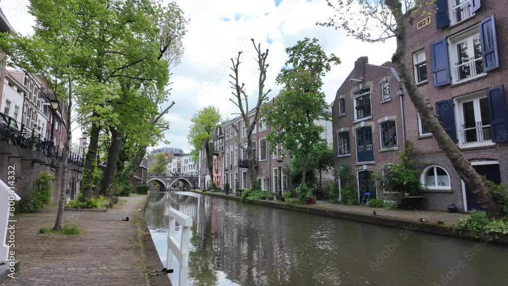 Utrecht Netherlands, City caputred on a sunny day with clouds. Utrecht city center river and channels with green trees Utrecht Netherlands, City caputred on a sunny day with clouds. Utrecht city center river and channels with green trees