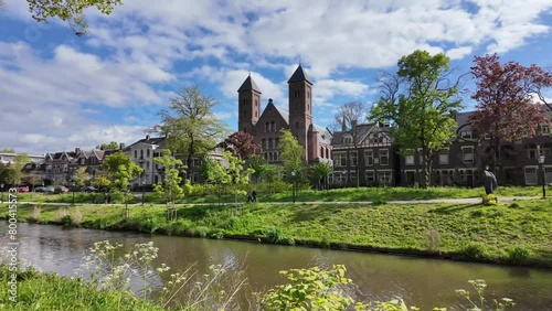 Utrecht Netherlands, City caputred on a sunny day with clouds. Utrecht city center river and channels with green trees photo