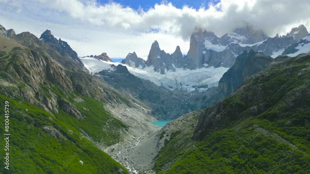 Monte Fitz Roy also known as Cerro Chalten, Cerro Fitz Ro is a mountain in Patagonia, on the border between Argentina and Chile. It is located near the town of El Chalten. Aerial drone view. Monte Fitz Roy also known as Cerro Chalten, Cerro Fitz Ro is a mountain in Patagonia, on the border between Argentina and Chile. It is located near the town of El Chalten. Aerial drone view.
