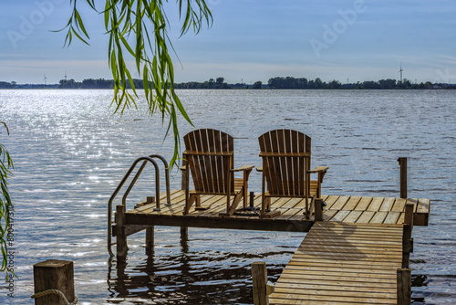 Rondeau Provincial Park lake Erie bay pier with muskoka chairs, Ontario, Canada