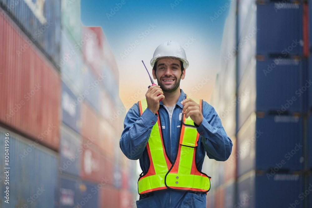 Smart Engineer or supervisor checking and control loading Containers box from Cargo at harbor.Foreman control Industrial Container Cargo freight ship at industry.Transportation and logistic concept. Smart Engineer or supervisor checking and control loading Containers box from Cargo at harbor.Foreman control Industrial Container Cargo freight ship at industry.Transportation and logistic concept.