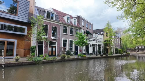 Utrecht Netherlands, City caputred on a sunny day with clouds. Utrecht city center river and channels with green trees photo