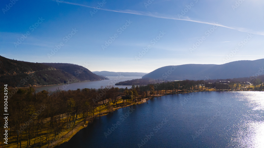 lake and mountains from panoramic view in day time. Open sky with mountains in the calm morning.