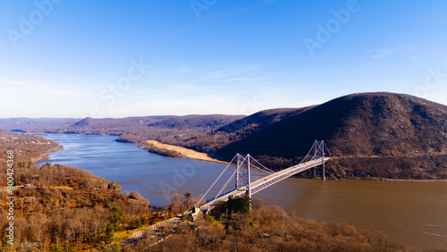 Bear mounting in autumn time with day time photo. Epic landscape view with the bridge crossing the river. photo