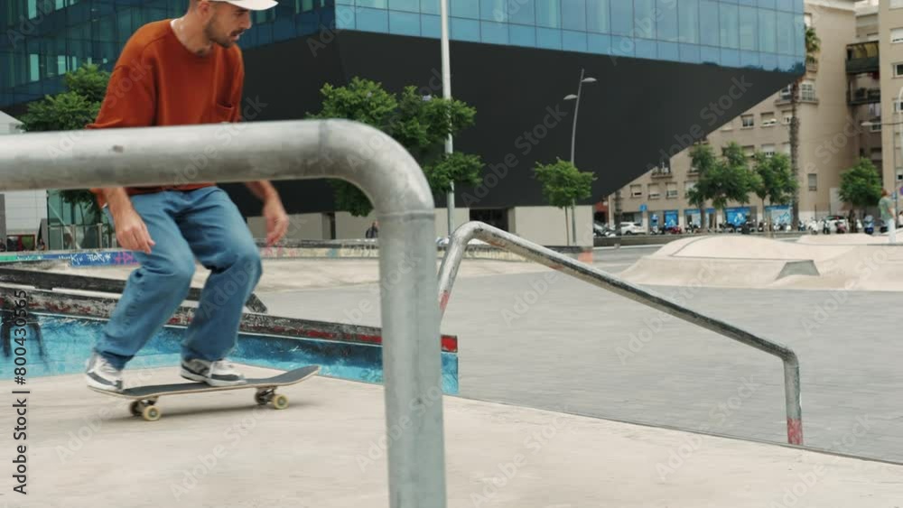 Young skater making 360 flip jump, performing kickflip trick, skateboarder training in skatepark, making tricks, slides and flips, professional extreme sport athlete training ride on skateboard. Young skater making 360 flip jump, performing kickflip trick, skateboarder training in skatepark, making tricks, slides and flips, professional extreme sport athlete training ride on skateboard.