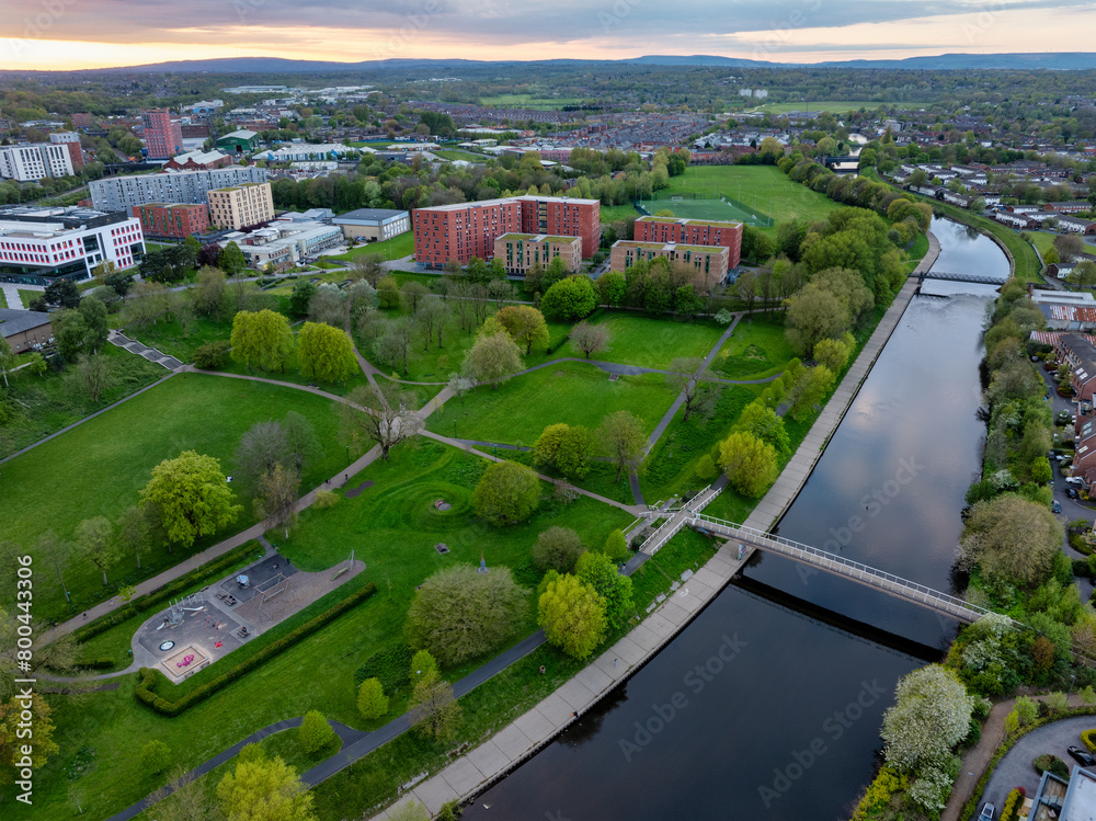 Aerial image of Peel park in Salford and footbridges over river Irwell 