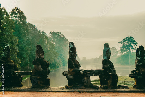 Statues of Buddha in the line in the temple Angkor Wat. photo