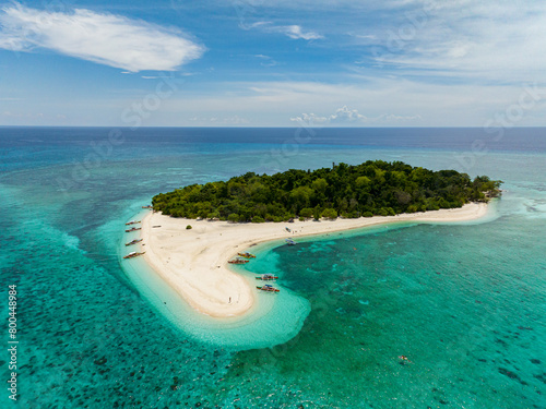 Beach with sandbar in Mantigue Island, coastal with boats. Camiguin, Philippines. Travel destination. photo