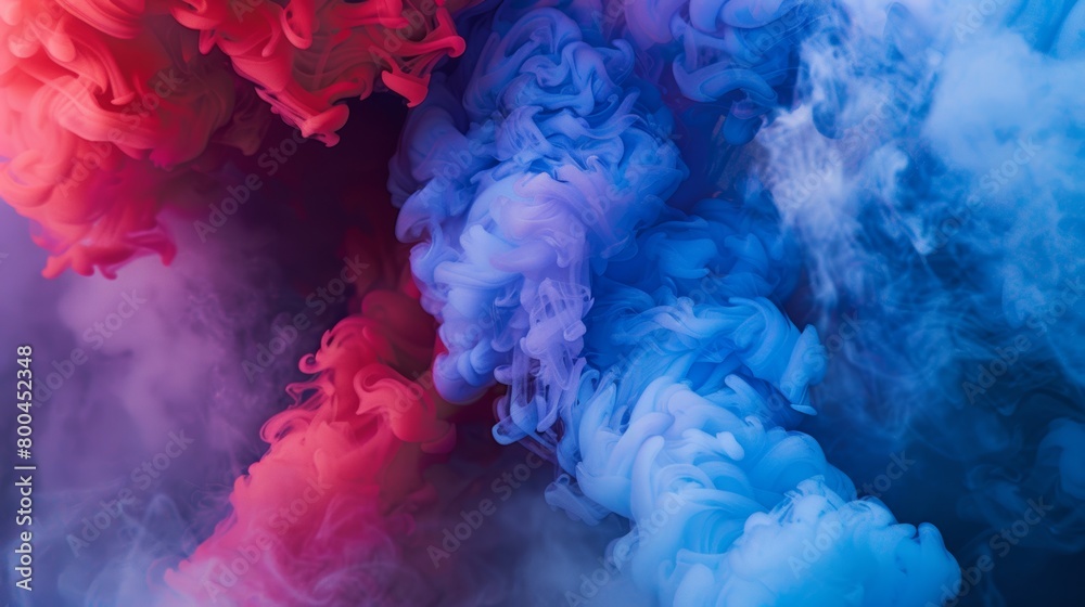 Vivid red and blue smoke intertwining Vivid red and blue smoke intertwining