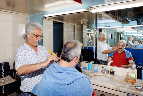 elderly man hairdresser photo