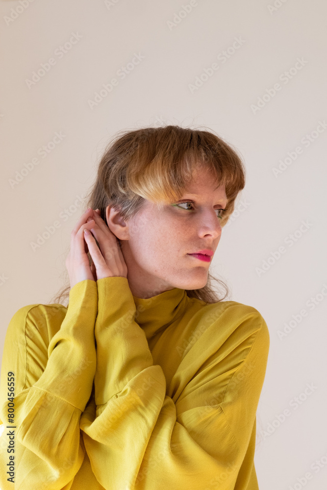 Portrait of a female model in a bright yellow blouse Portrait of a female model in a bright yellow blouse