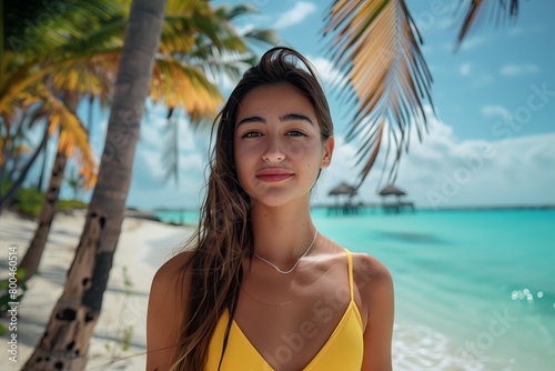 modern young woman in a yellow swimsuit, beach, palm trees, ocean shore
