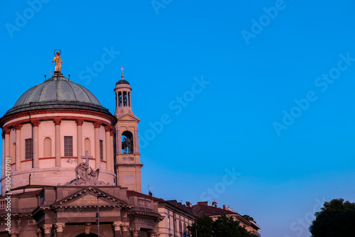 Scenic sunset view of church Chiesa Prepositurale di Santa Maria Immacolata delle Grazie (Barriera delle Grazie) in Bergamo, Lombardy, Northern Italy, Europe. Baroque bell tower and dome. Neoclassical photo