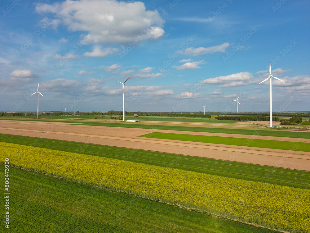 Spring farmland and electric windmills. Spring farmland and electric windmills.