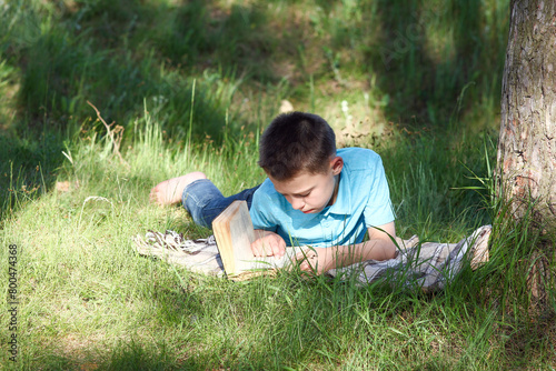 child boy  read book  Holy bible on nature