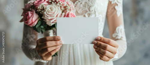 Closeup woman bride holding empty blank business card in hands, mockup with copy space.