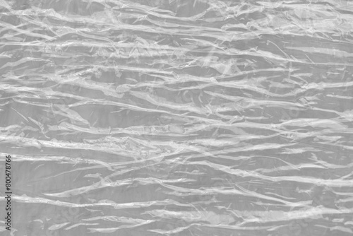 Used wrinkled stretch shrink packaging cling film pallet wrap for moving home, furniture, luggage and parcel texture background. 