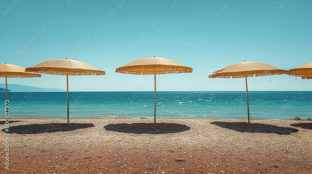 Tropical with umbrella summer landscape of the beach. Vacation on beautiful island, sand, ocean and blue sky.