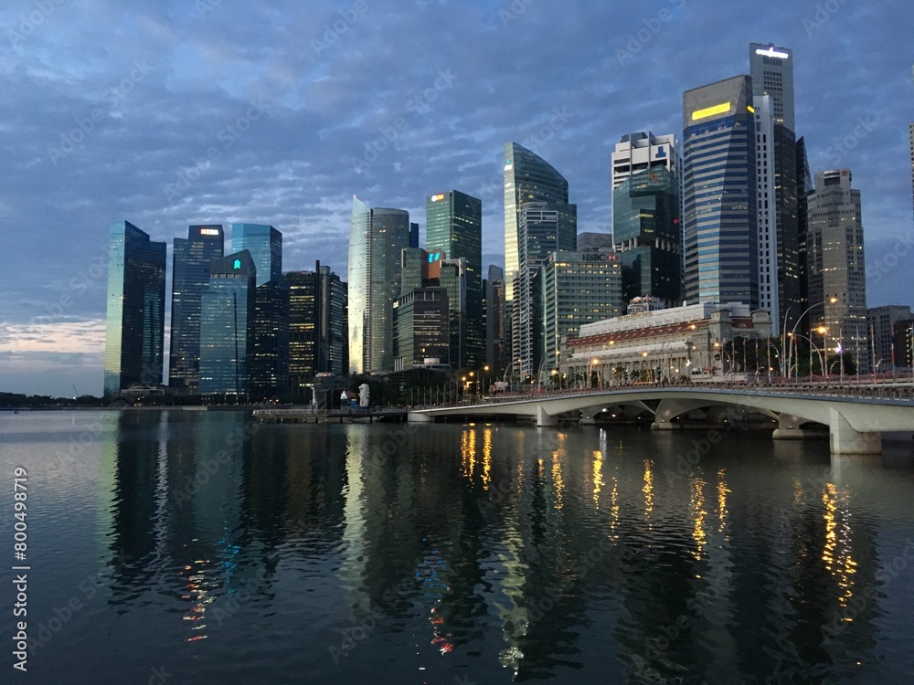 Singapore skyline and the Esplanade bridge at night reflected in Marina Bay, Singapore, February 2019
