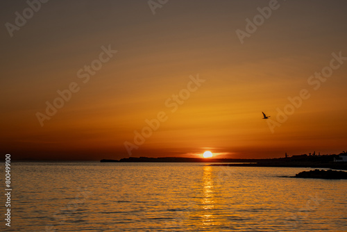 Fototapeta Naklejka Na Ścianę i Meble -  Spectacular sunset from Biniancolla cove, on the island of Menorca, Spain