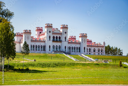 Restoration of an old medieval castle. Beautiful facade of the palace in Kossovo, Brest region, Belarus. Summer landscape. photo