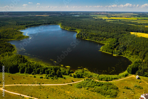 Top view of Bolta lake in the forest in the Braslav lakes National Park at dawn, the most beautiful places in Belarus.An island in the lake.Belarus.