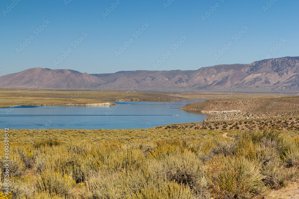 a panoramic overlook over the famous Crowley lake at a bright sunny summer day in California 