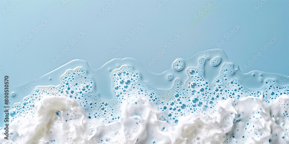 Spot of thick shampoo foam on a blue background. top view with copy space for text Spot of thick shampoo foam on a blue background. top view with copy space for text