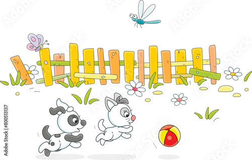 Happy little puppy and kitten playing with a toy ball in a yard of an old village house with a fence in countryside on a pretty summer day, vector cartoon illustration on a white background
