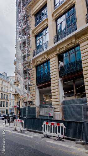 Paris, France, April 14th, 2024 European city street with traditional architecture and construction scaffolding, symbolizing urban development and renovation