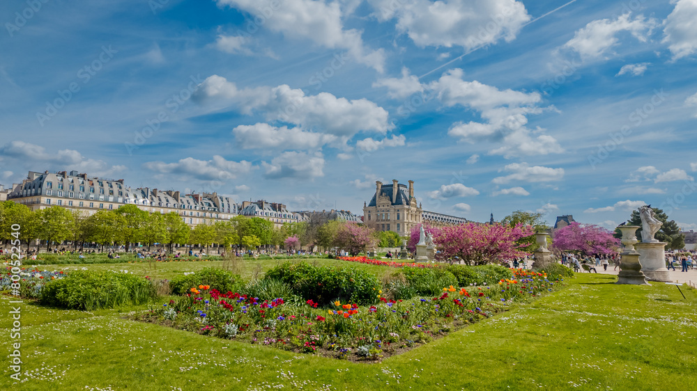 Lush springtime gardens in bloom with vibrant flowers at the historic Tuileries Garden in Paris, perfect for travel and Easter backgrounds