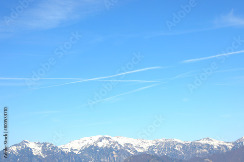 mountain with white chemtrails left by the Ari or something else According to the conspiracy theory photo
