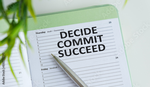 Conceptual hand writing showing Decide Commit Succeed. Business photo text achieving goal comes in three steps Reach your dreams Register pages handwriting text work stationery items woody table.