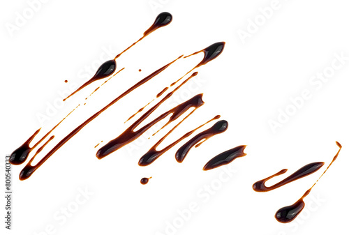 Sweet chocolate sauce isolated on a white background. Melted chocolate sauce. © domnitsky