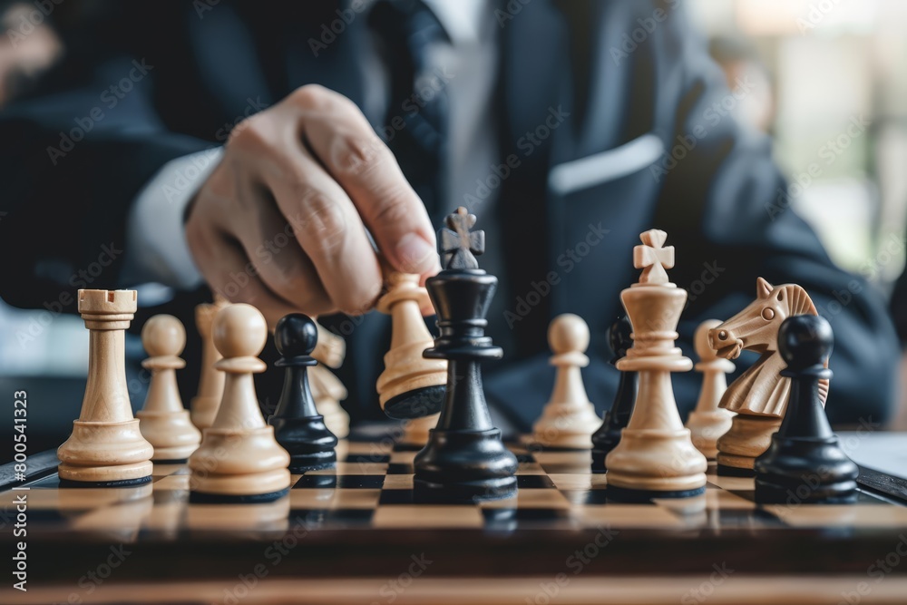 A photo of a person playing chess A photo of a person playing chess