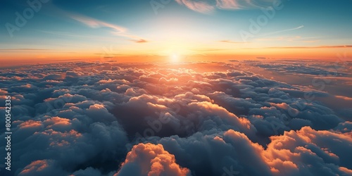 Aerial view of a beautiful sunset as seen from the plane, view above the clouds #800542335
