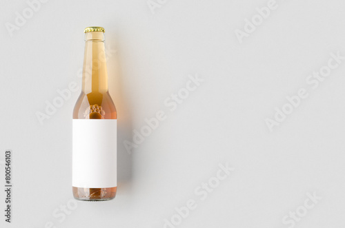 Clear longneck beer bottle mockup with blank label and copyspace. photo