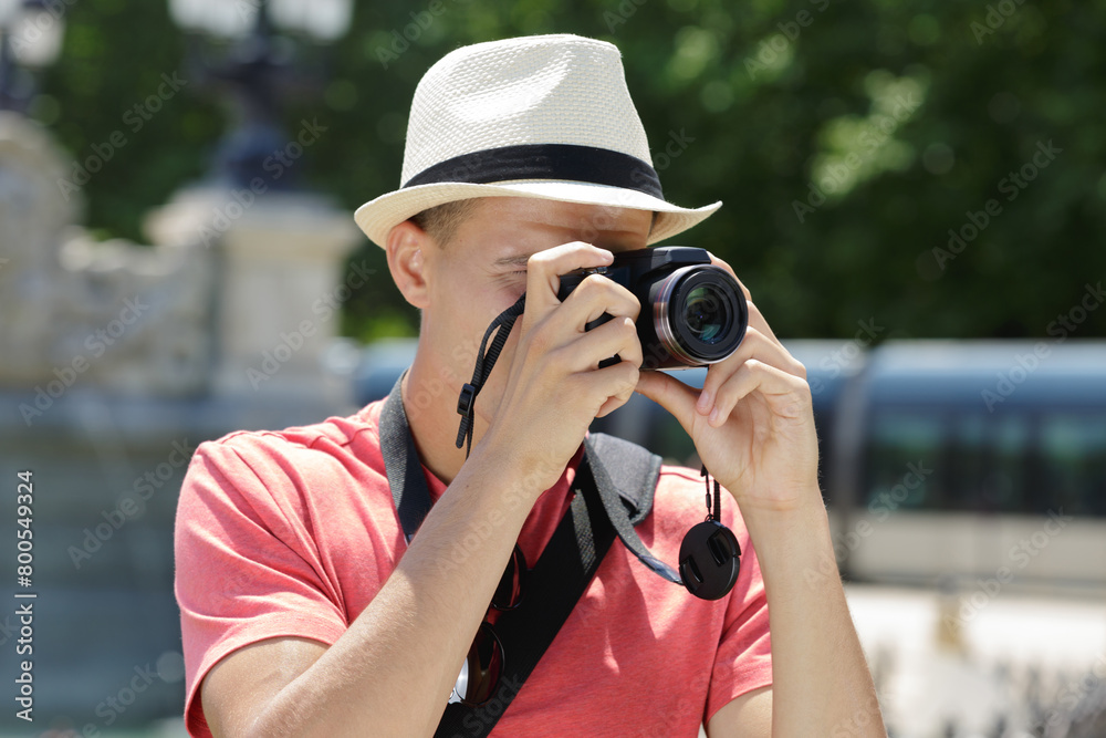 a young man taking a photo