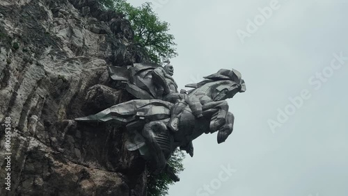 The monument of Uastyrdzhi: the legend of North Ossetia. ALAGIR, RUSSIA - MAY 14, 2023: Monument to Nihas Uastyrdzhi (St. George the Victorious) on the Trans-Caucasian highway on a cloudy day. Alanya photo