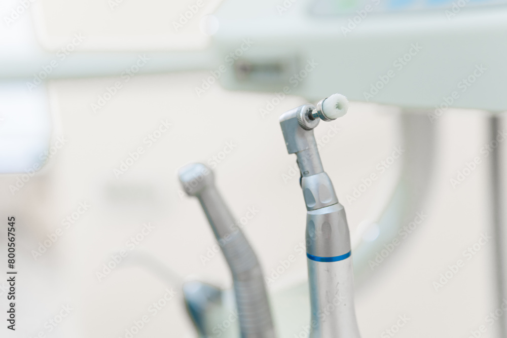 Dentist workspace with modern chair, equipment and instruments