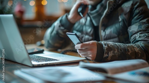 A person talking on the phone with their insurance company's customer service representative, seeking assistance with policy questions or claims processing.