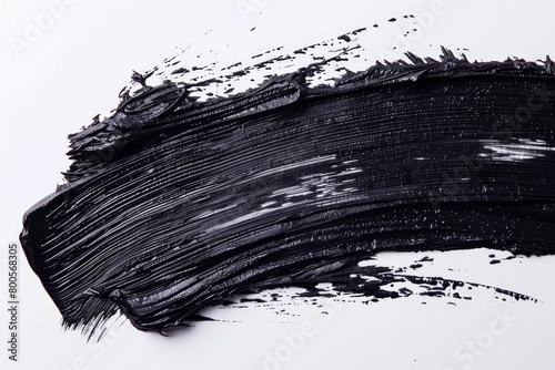 bold black mascara smudge with dramatic brush stroke texture abstract background