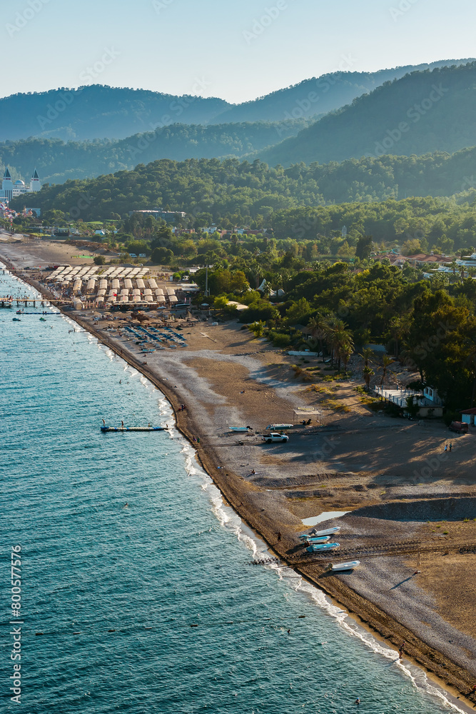 The aerial beauty of the Turkish seaside, showcasing calm waters, a lush peninsula, and grand mountains