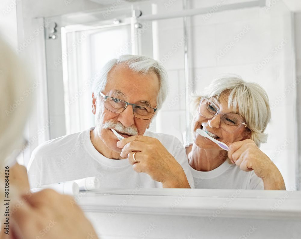 Obraz premium woman tooth bathroom toothbrush hygiene senior morning routine brushing toothpaste care dental elderly home retirement mouth mirror health cleaning man couple