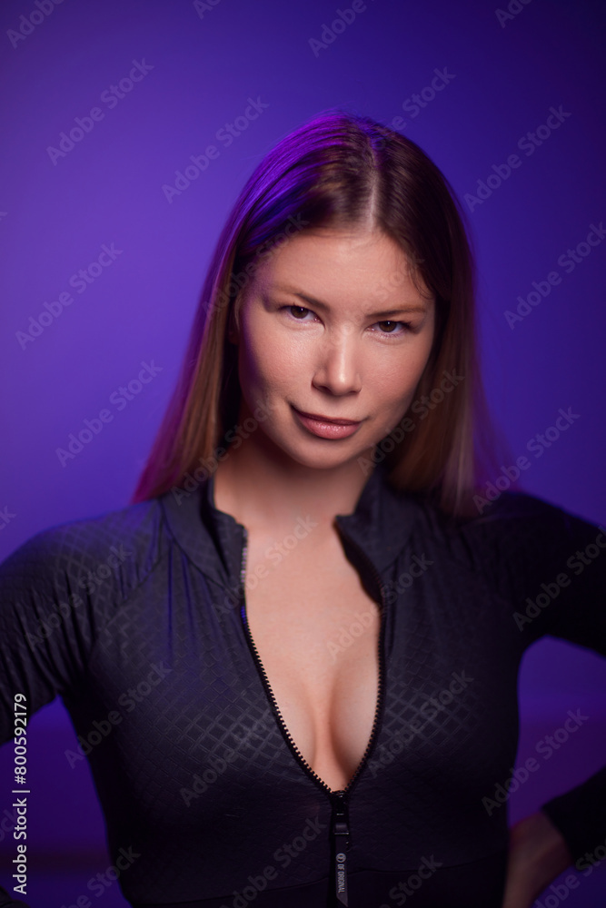 Fototapeta premium a happy woman holds a soft block for sports in her hands