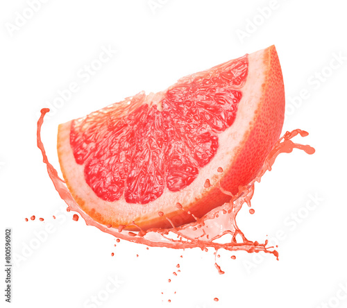 Fresh grapefruit with splashing juice on white background photo