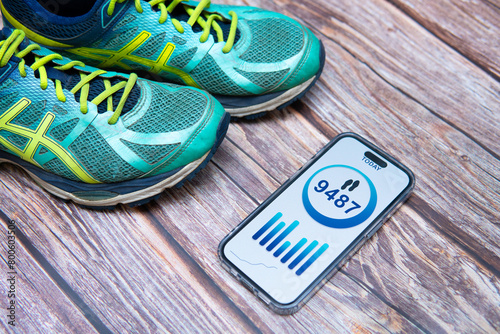 A flat lay photo showcasing a step counting app on a smartphone screen. Conceptual image illustrating healthy habits photo