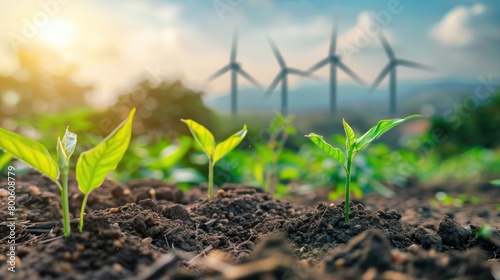 Closeup young sprouts or plants growing on the soil with wind turbine energy background. Generate AI