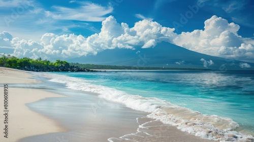 Crystal-clear turquoise waters gently lap at the white sandy beach, with lush greenery and the silhouetted Mount Agung framing the idyllic scene